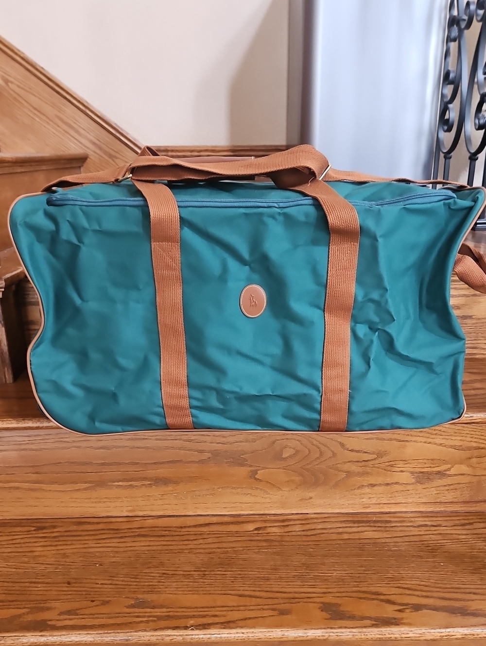 Vntage Polo Ralph Lauren hunter green canvas duffel bag features brown web